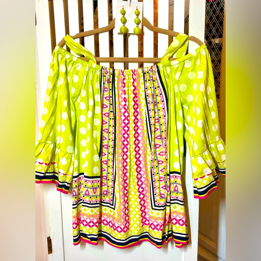 Lime off the shoulder top with coordinating earrings.